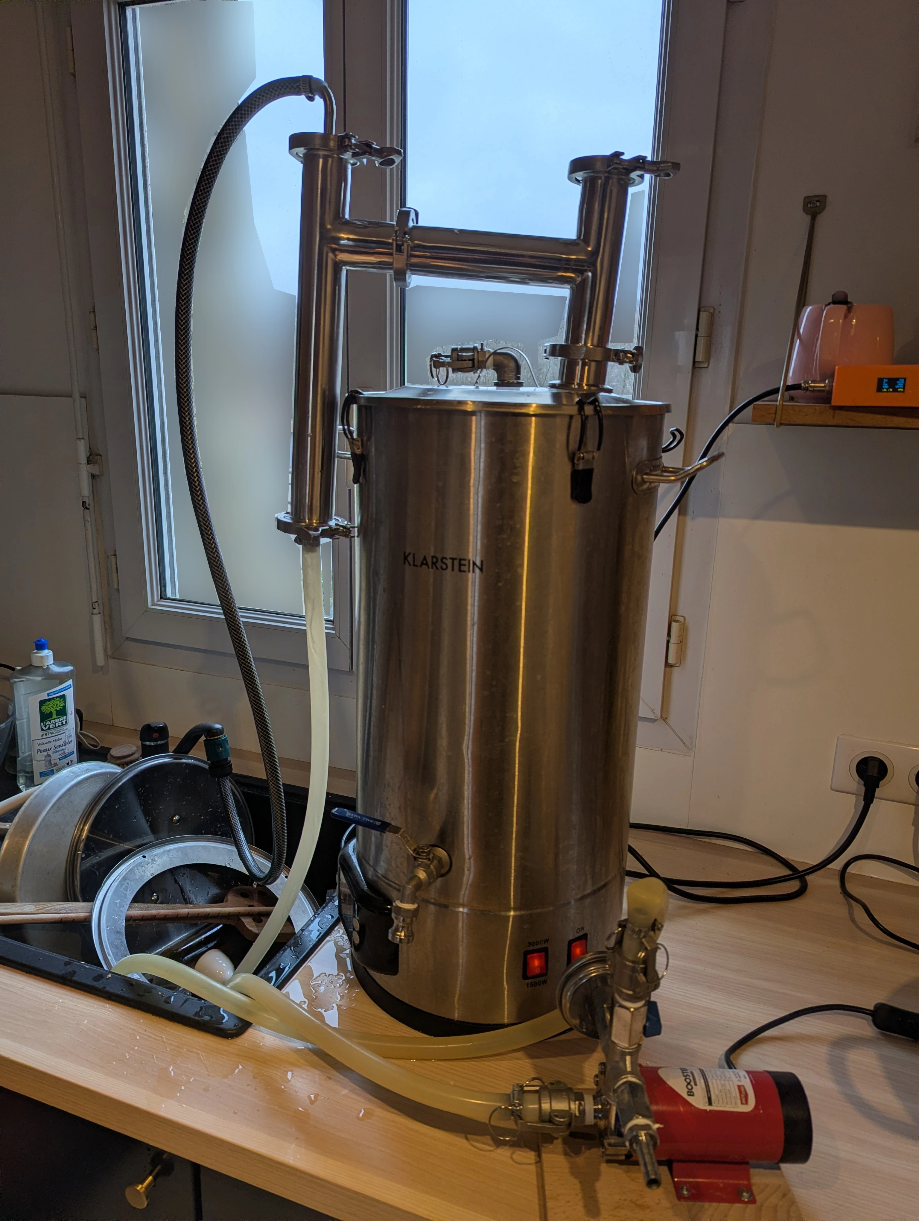 A photograph of kettle during boil with a condenser